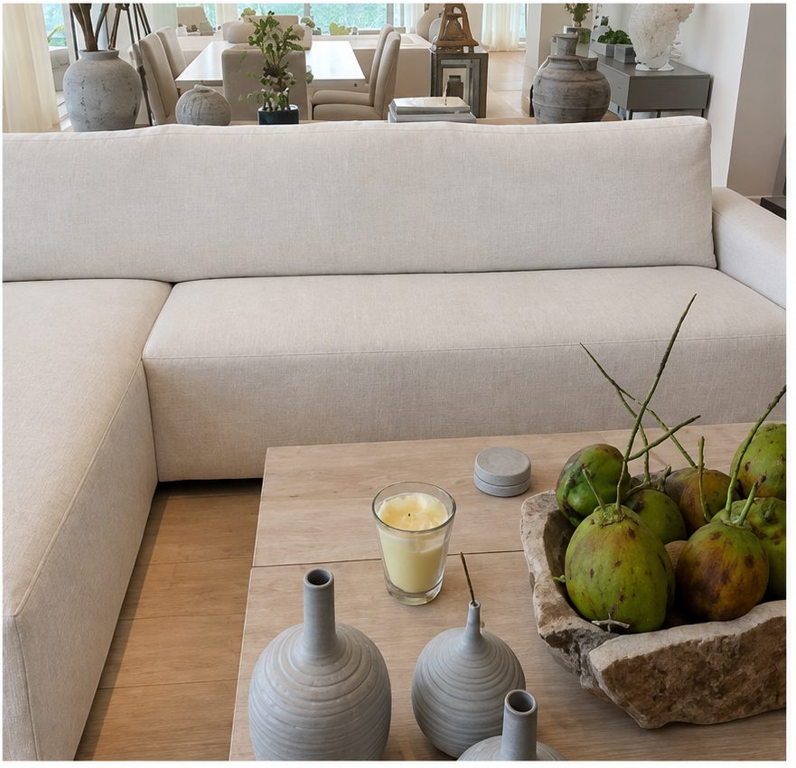 Beige linen sectional sofa beside a light wood coffee table.